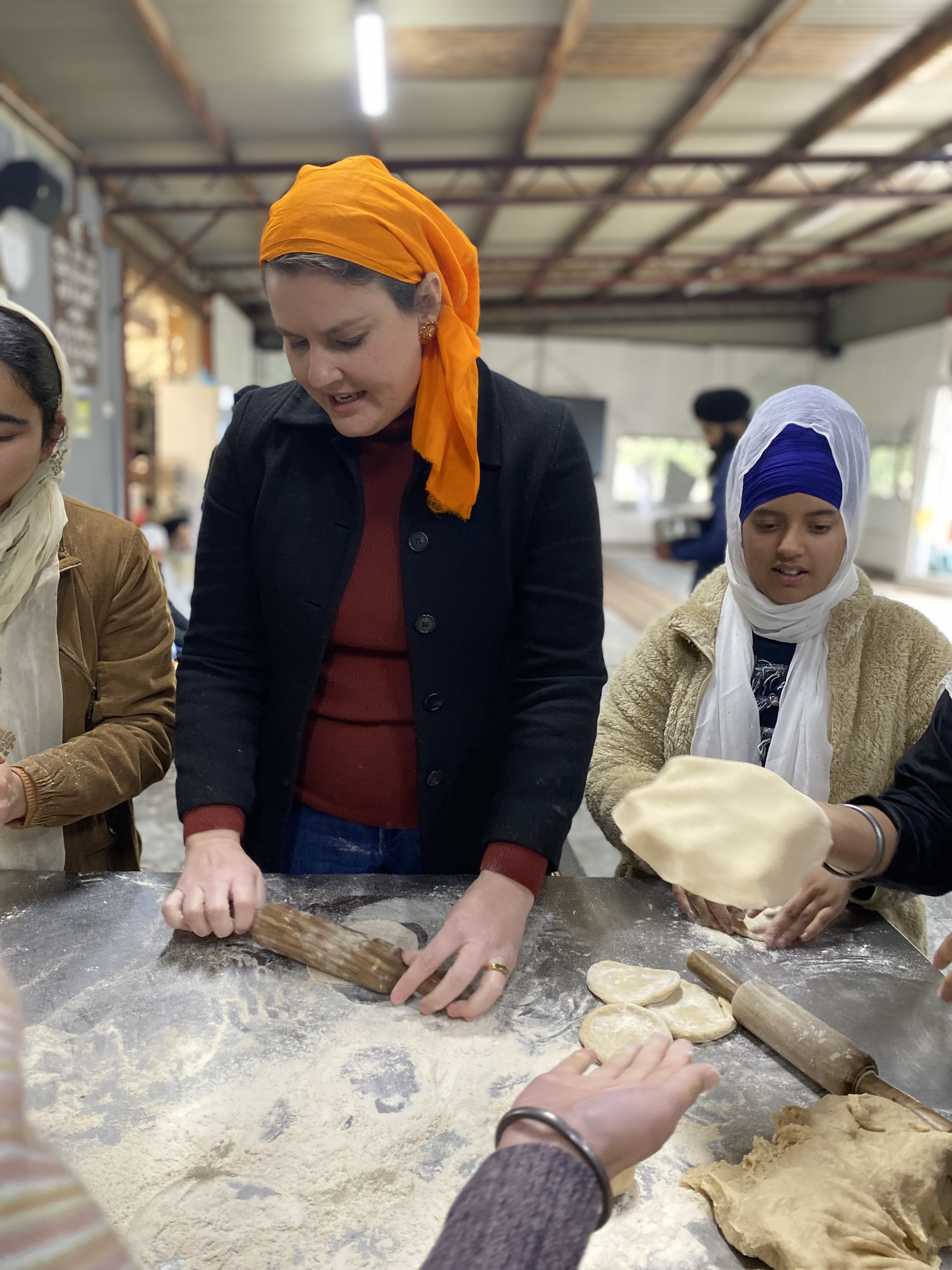 Rolling out the bread for Sunday School at the Sikh Welfare Centre.